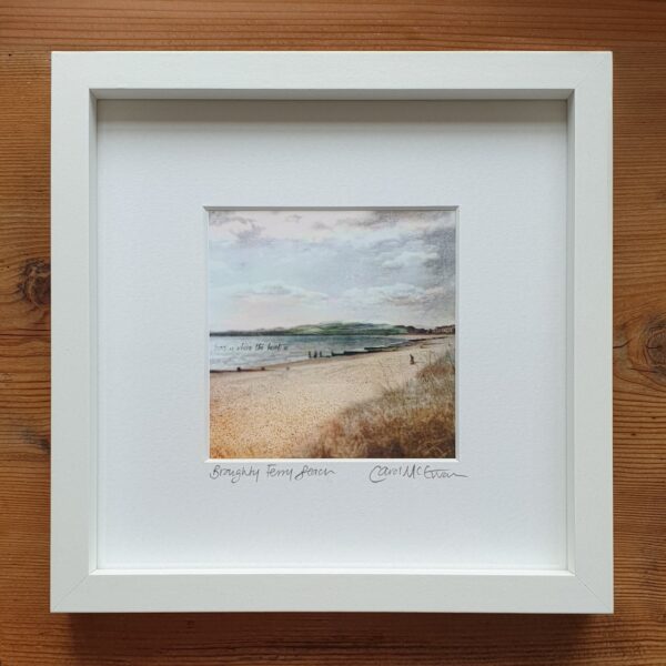 Broughty Ferry Print in a white, wooden frame on top of a wooden table texture