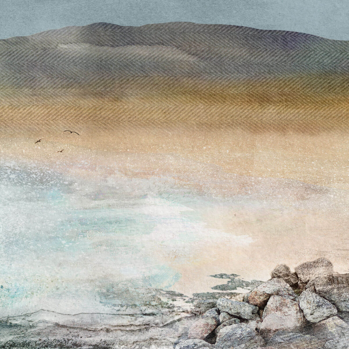 2 print of 3 of Nisabost beach on Harris. This print is a view of the sea lapping on the beach. The sand is pale yellow and the ocean is an aqua coloured calm sea. There are grey rocks in the foreground and in the distance there is low mountains.