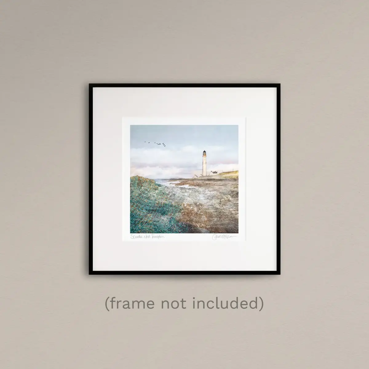 Scurdie Ness lighthouse print in a thin black frame on a beige wall