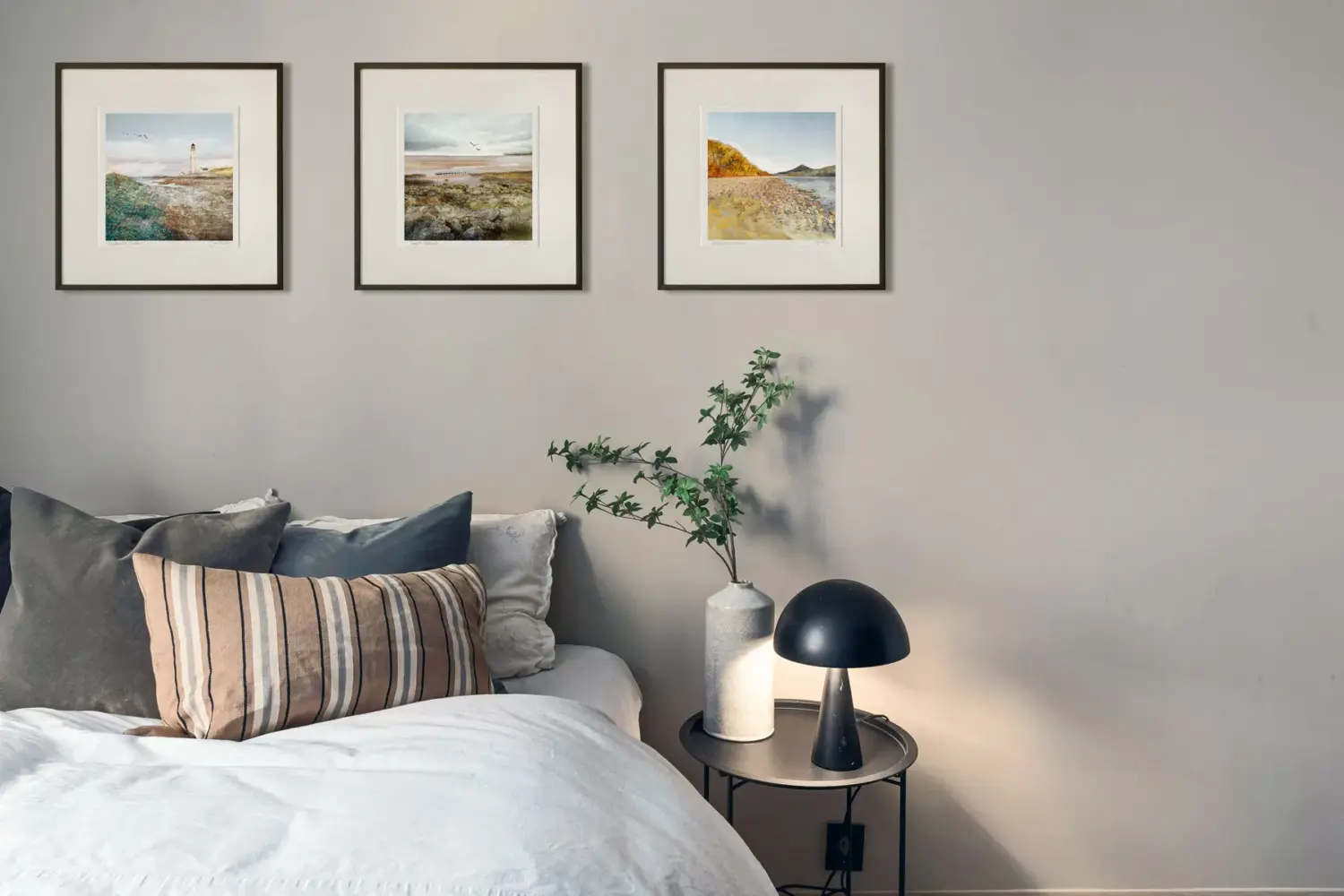 Scottish art prints on bedroom wall. Artwork by Carol McEwan